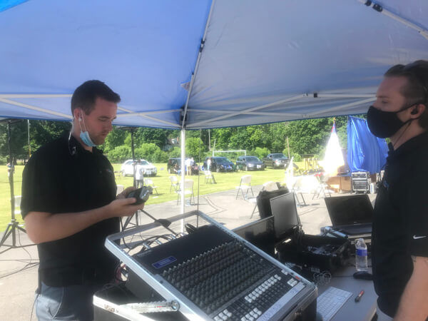 Francis AV staff working livestreaming hardware