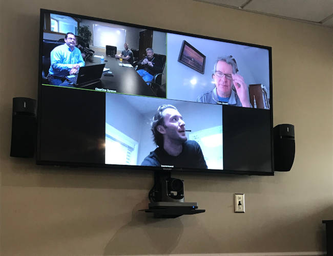 Wall-mounted display, PTZ camera and speakers